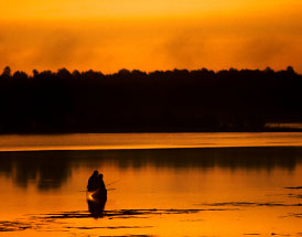 Tow Wisconsin Fisherman fishing at Sunset.